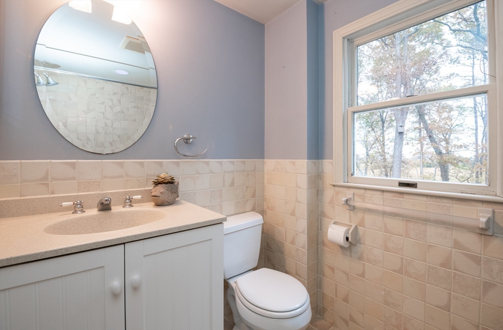 6 Island Park Road Ipswich, MA 01938 - Photo 24 of 41 a bathroom with a toilet a sink a mirror and bathtub