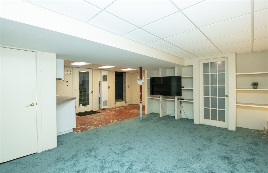 6 Island Park Road Ipswich, MA 01938 - Photo 36 of 41 a view of a livingroom with furniture and a flat screen tv