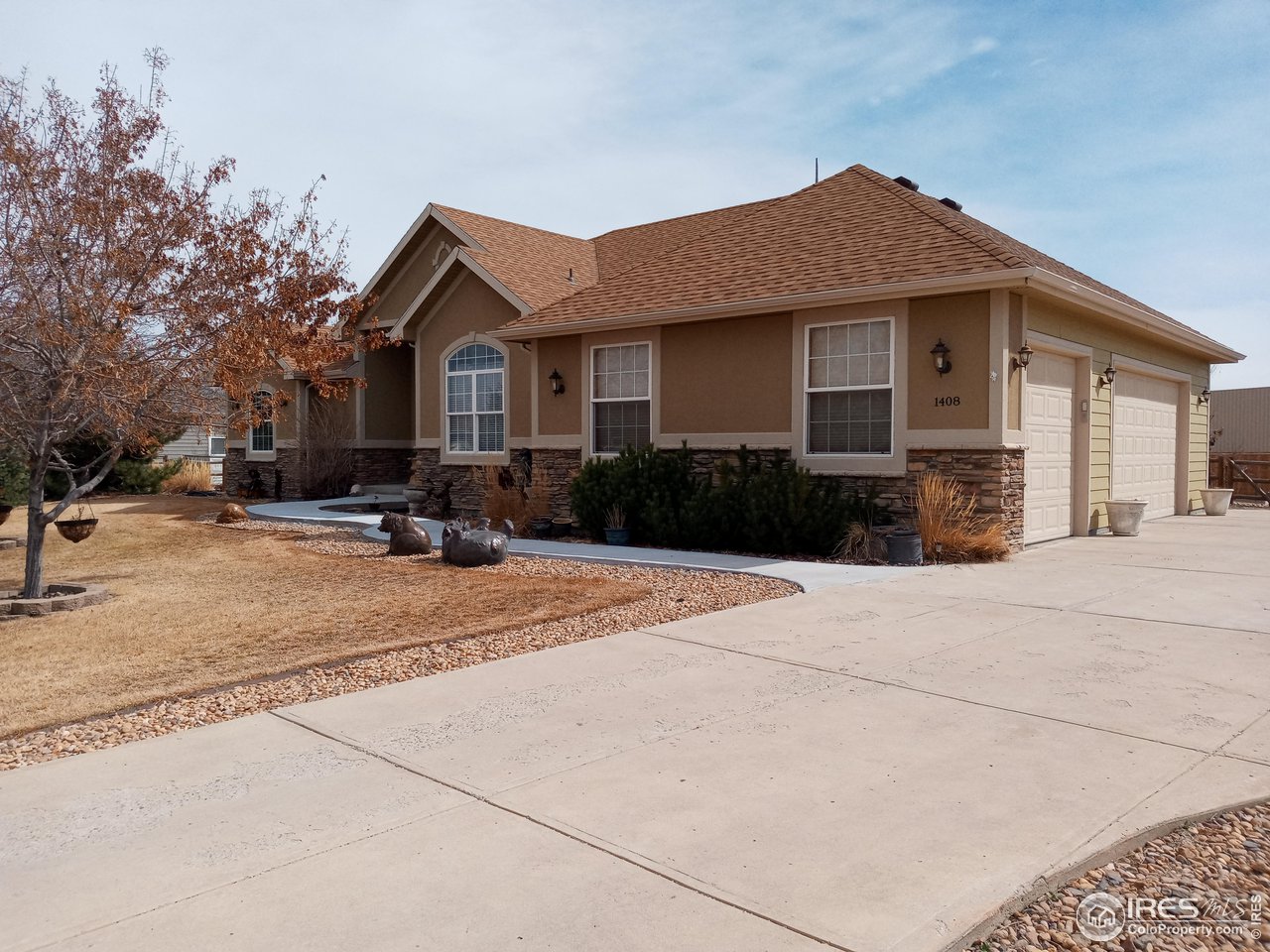 1408 Red Fox Circle Severance, CO 80550 - Photo 3 of 24 a front view of a house with a yard