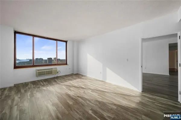 a view of an empty room and window