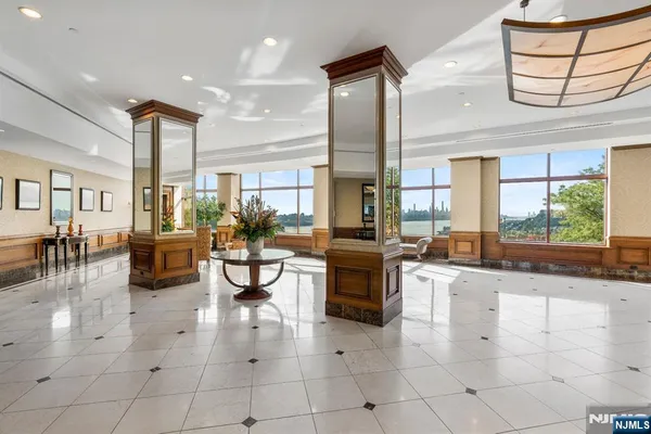 a lobby with furniture and a large window
