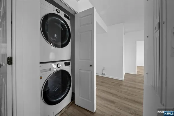 a view of a hallway with washer and dryer