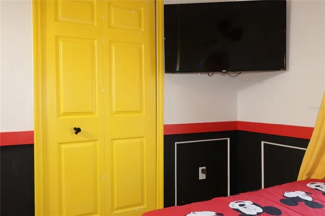 a bedroom with a bed and window