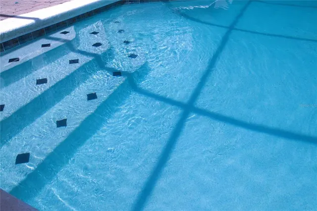 a building outdoor space with patio furniture and potted plants