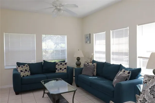 a living room with furniture and a large window