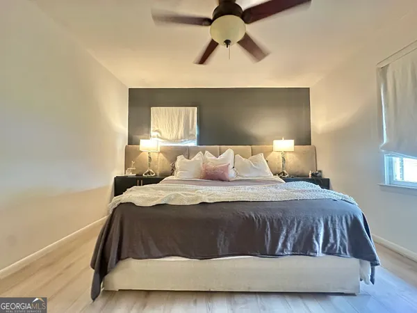 a bedroom with a bed and window