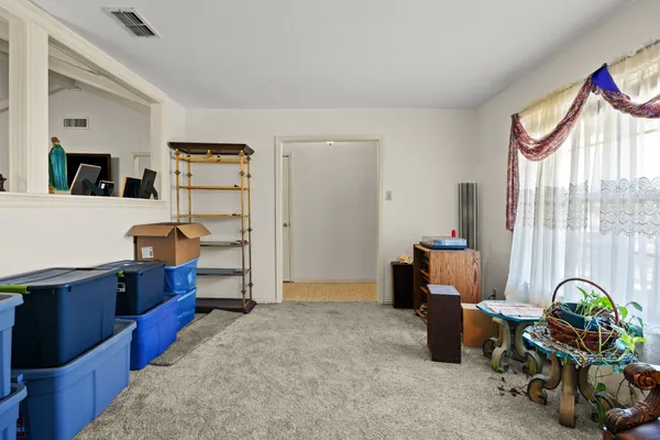 a bedroom with furniture and a chandelier
