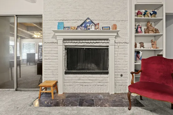a kitchen with a sink a stove and chairs