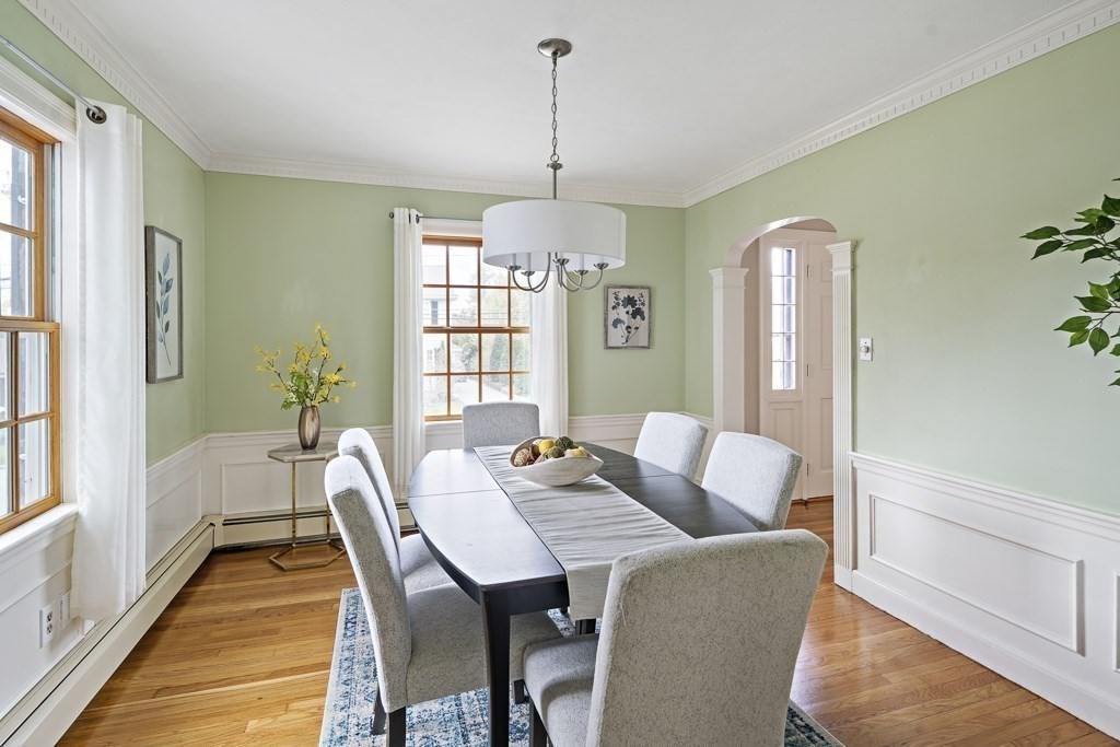7 Perkins Road Winchester, MA 01890 - Photo 16 of 38 a dining room with furniture a chandelier and wooden floor