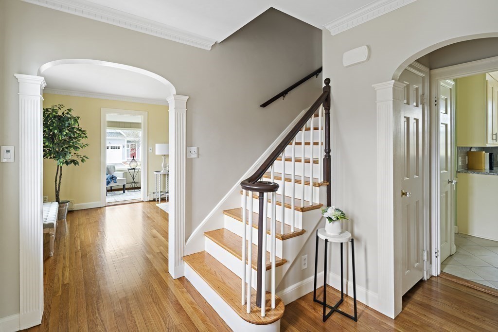 7 Perkins Road Winchester, MA 01890 - Photo 3 of 38 a view of a hallway with wooden floor and staircase