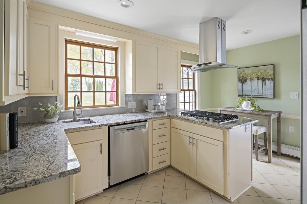 7 Perkins Road Winchester, MA 01890 - Photo 8 of 38 a kitchen with granite countertop white cabinets and appliances