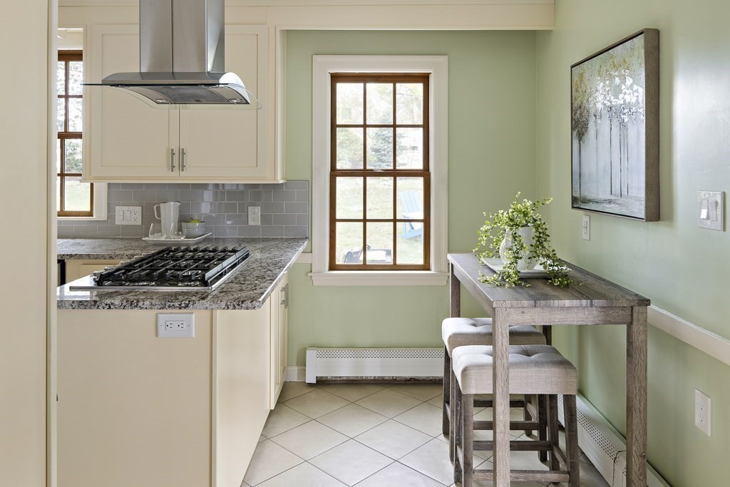 7 Perkins Road Winchester, MA 01890 - Photo 10 of 38 a kitchen with a table and chairs in it