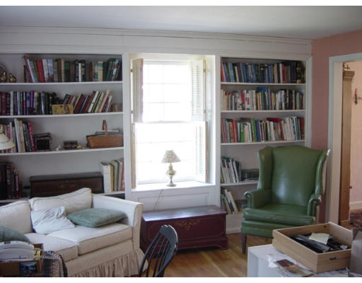 13 Whiting Road Framingham, MA 01701 - Photo 24 of 30 a living room with furniture and a book shelf
