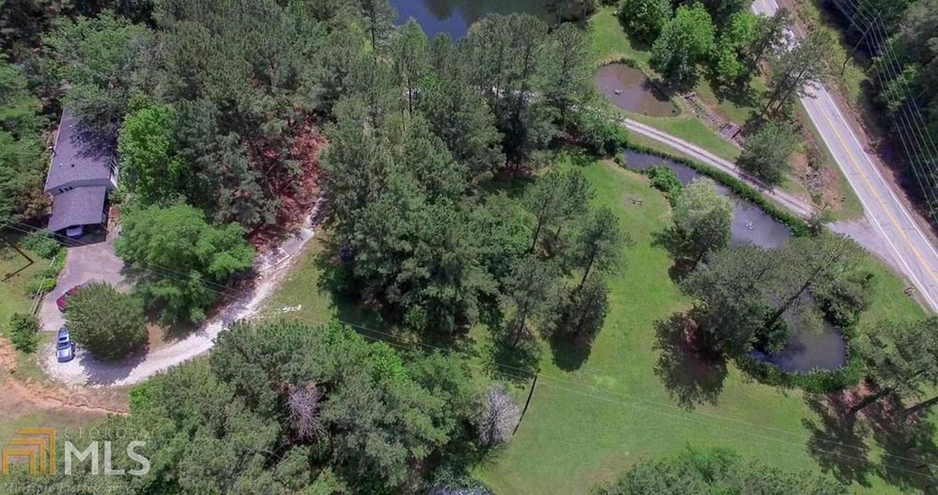 4529 Fosters Mill Road Cave Spring, GA 30124 - Photo 1 of 1 an aerial view of residential house with outdoor space and trees all around