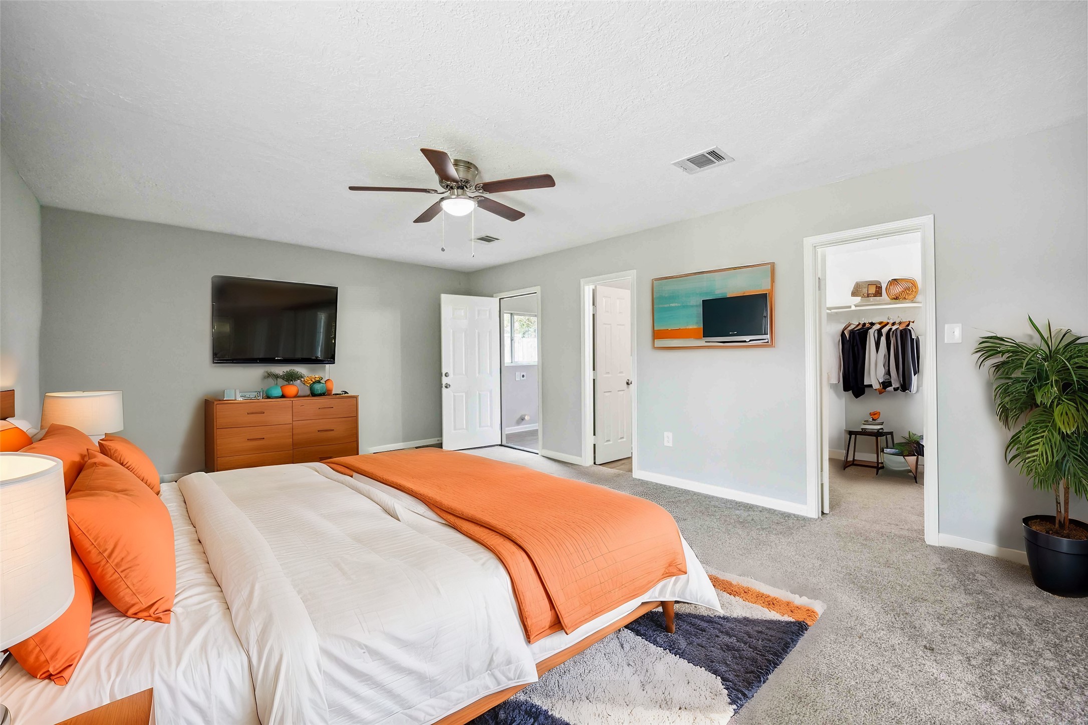 7150 Mobud Drive Houston, TX 77074 - Photo 12 of 29 a bedroom with a bed and a flat screen tv