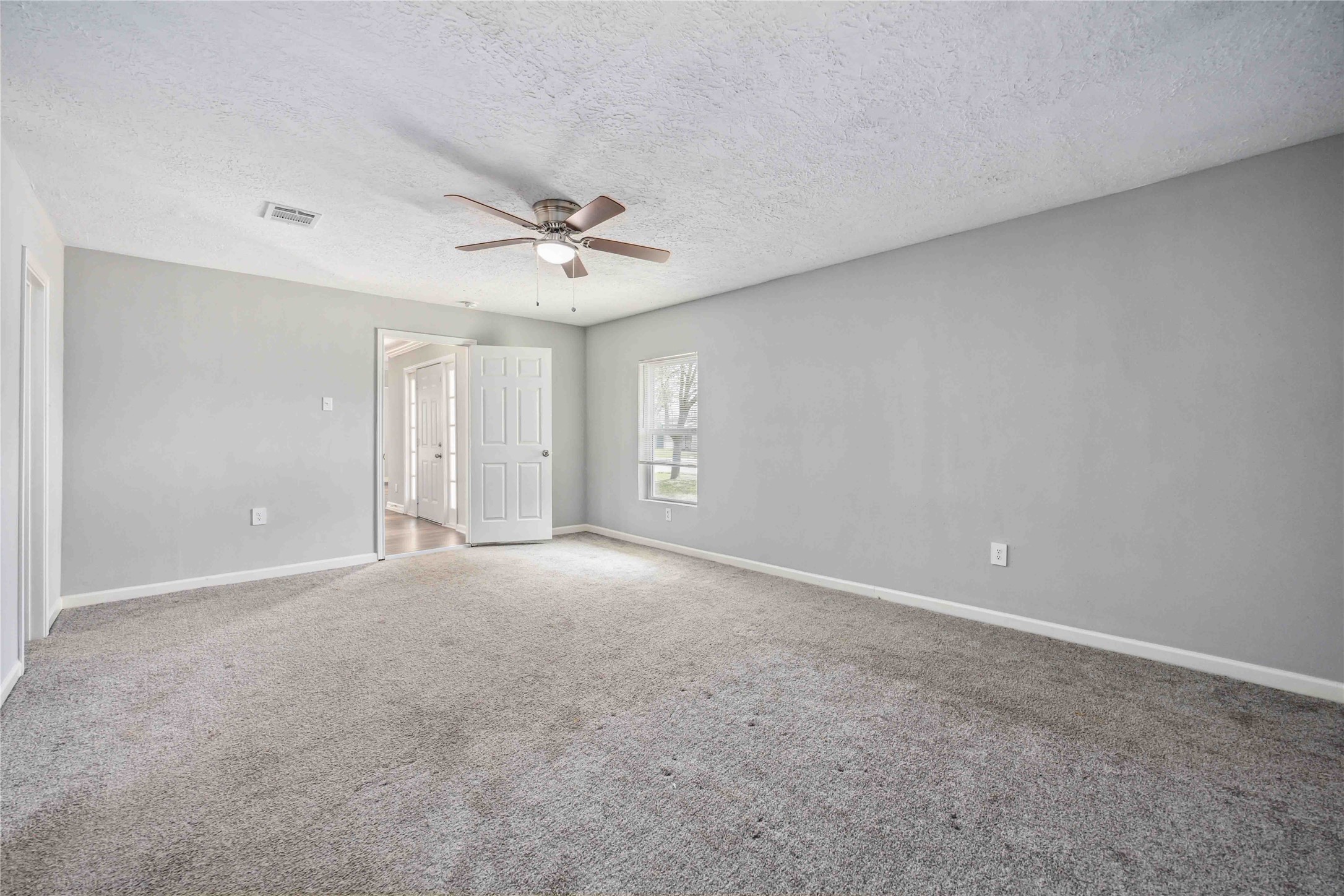 7150 Mobud Drive Houston, TX 77074 - Photo 13 of 29 a view of an empty room with a ceiling fan