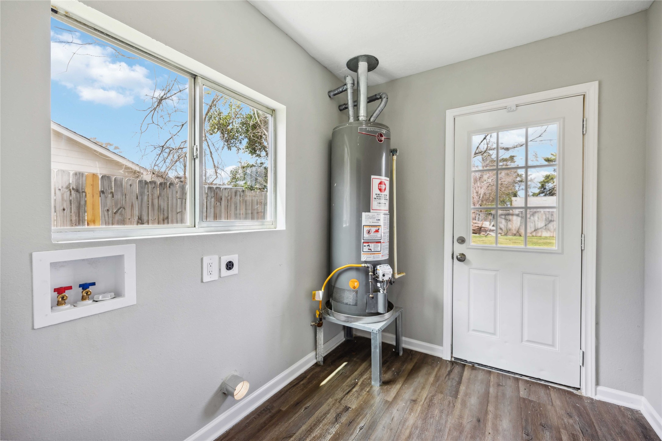 7150 Mobud Drive Houston, TX 77074 - Photo 16 of 29 a view of room with window and wooden floor