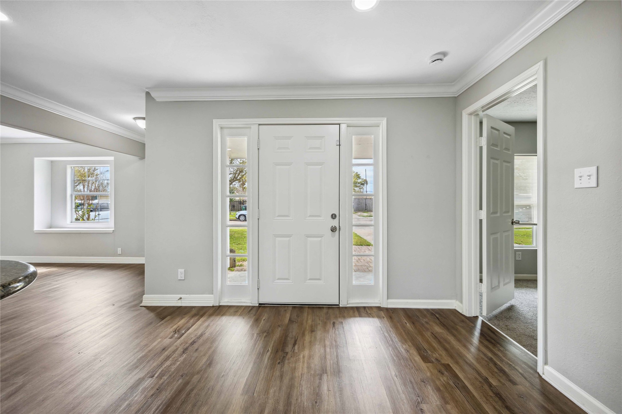 7150 Mobud Drive Houston, TX 77074 - Photo 3 of 29 wooden floor in an empty room with a window