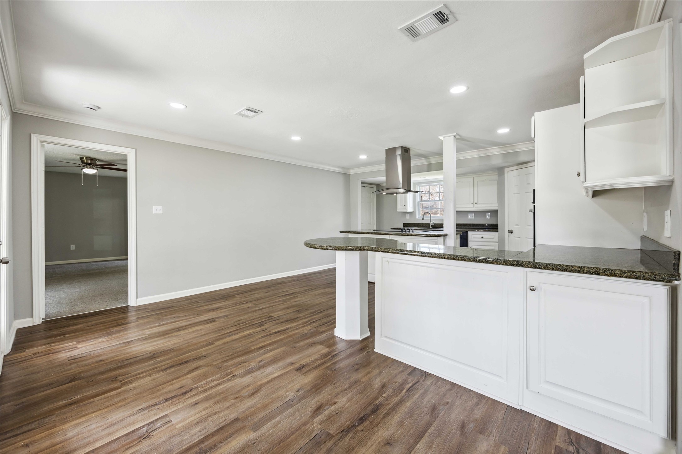 7150 Mobud Drive Houston, TX 77074 - Photo 8 of 29 a kitchen with stainless steel appliances granite countertop a sink a stove a microwave and white cabinets
