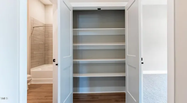a walk in closet with a vanity