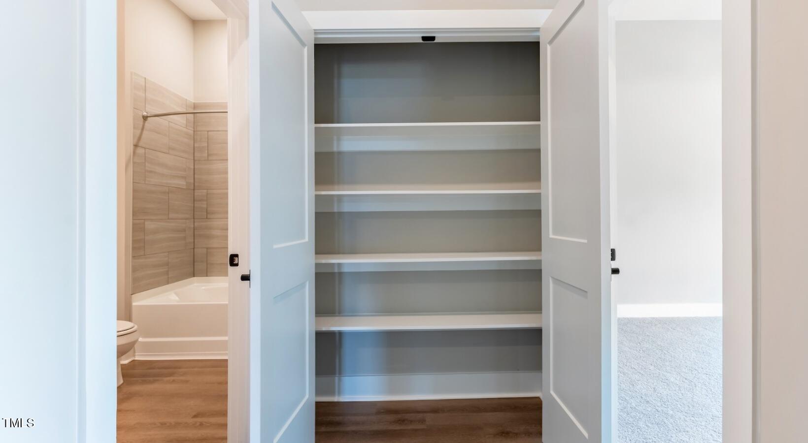 255 East Chatham Street, Unit A1 Cary, NC 27511 - Photo 14 of 31 a walk in closet with a vanity