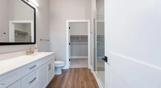 a view of walk in closet with white walls