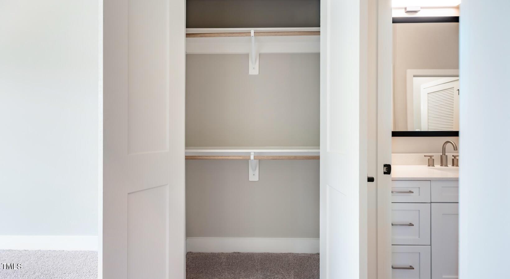 255 East Chatham Street, Unit A1 Cary, NC 27511 - Photo 23 of 31 a view of walk in closet with white walls