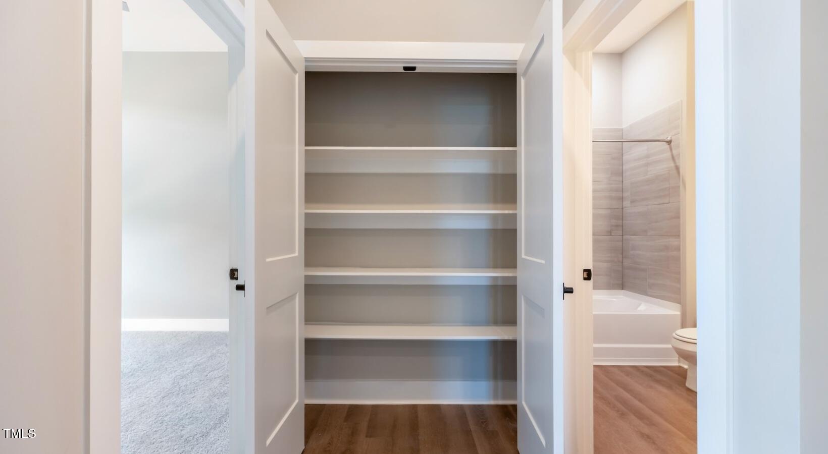 255 East Chatham Street, Unit A1 Cary, NC 27511 - Photo 29 of 31 a view of walk in closet with empty racks