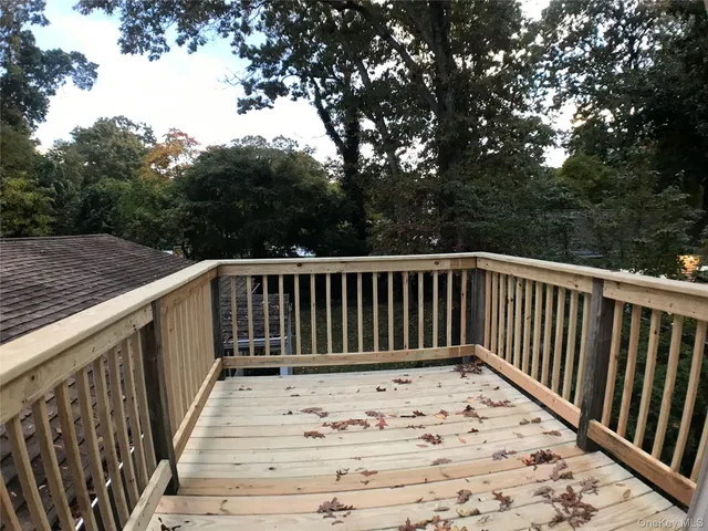 a view of balcony with wooden fence