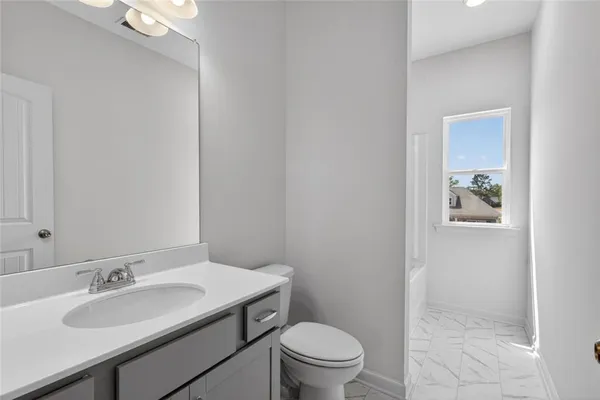 a bedroom with a bed and a dresser in it