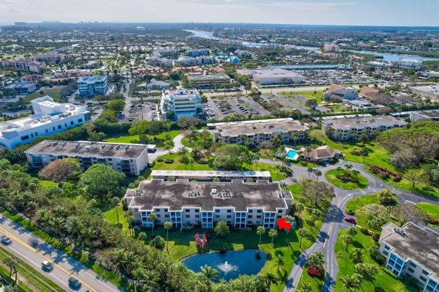 an aerial view of a houses and an outdoor space