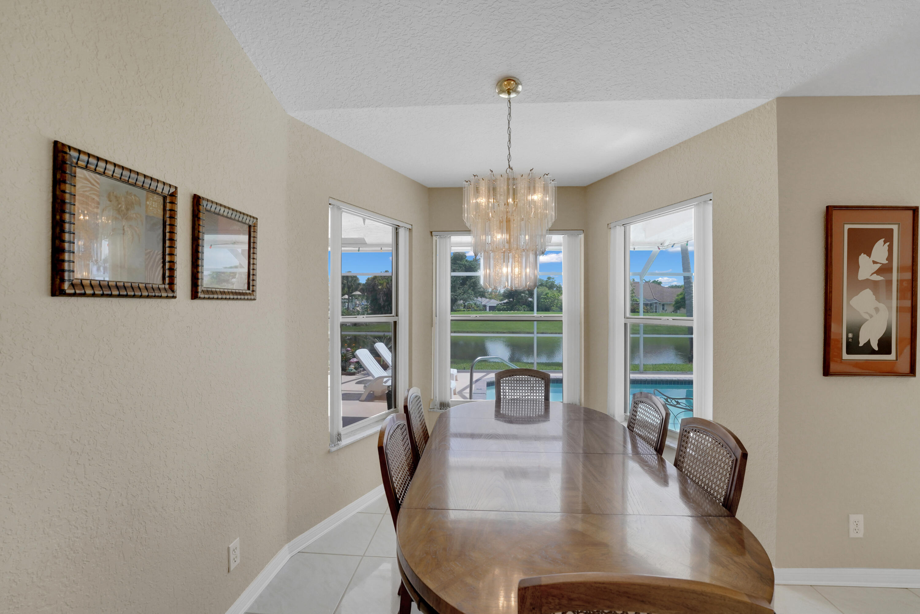 22331 Kettle Creek Way Boca Raton, FL 33428 - Photo 18 of 86 a view of a dining room with furniture window and wooden floor