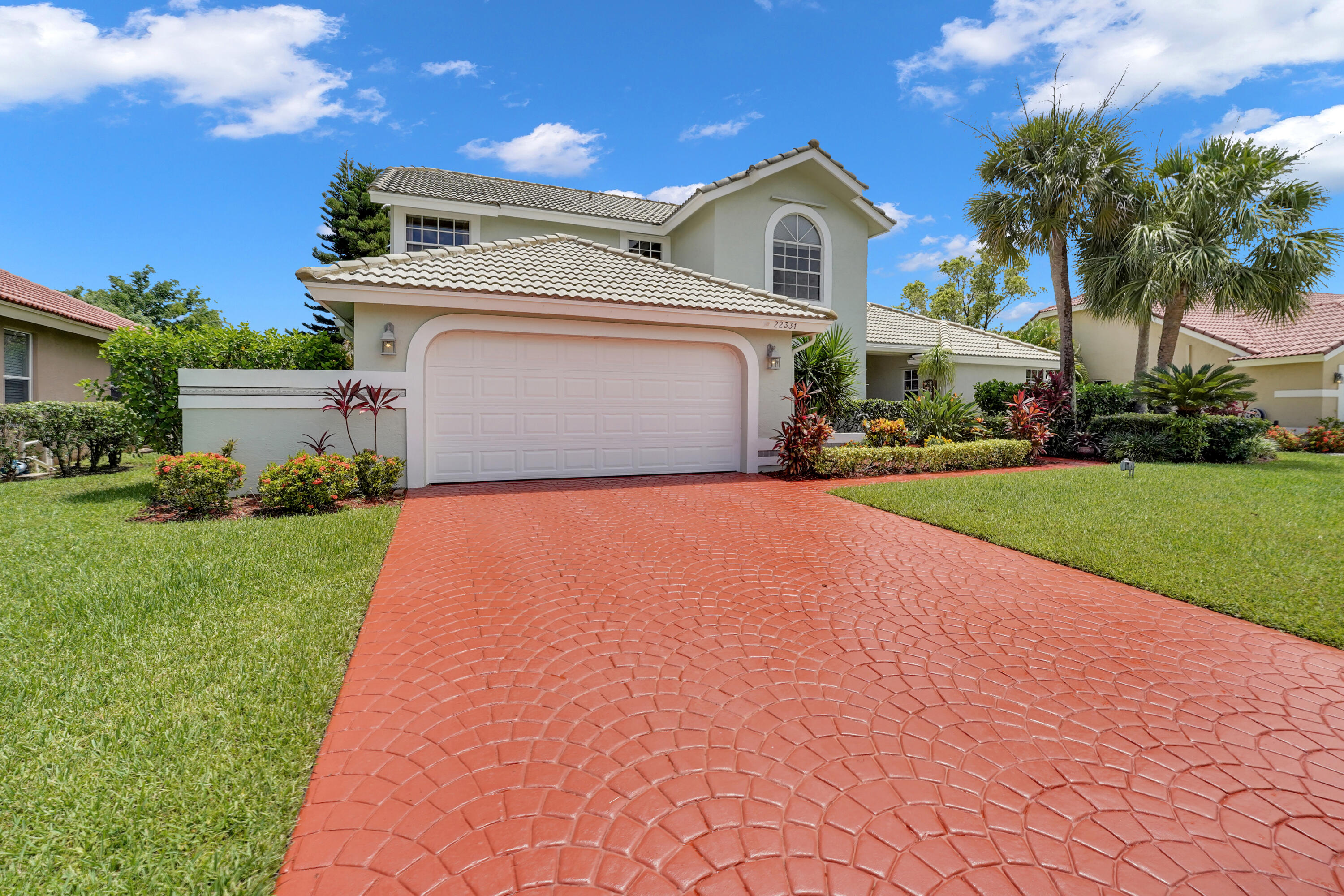 22331 Kettle Creek Way Boca Raton, FL 33428 - Photo 3 of 86 a front view of a house with a garden and yard