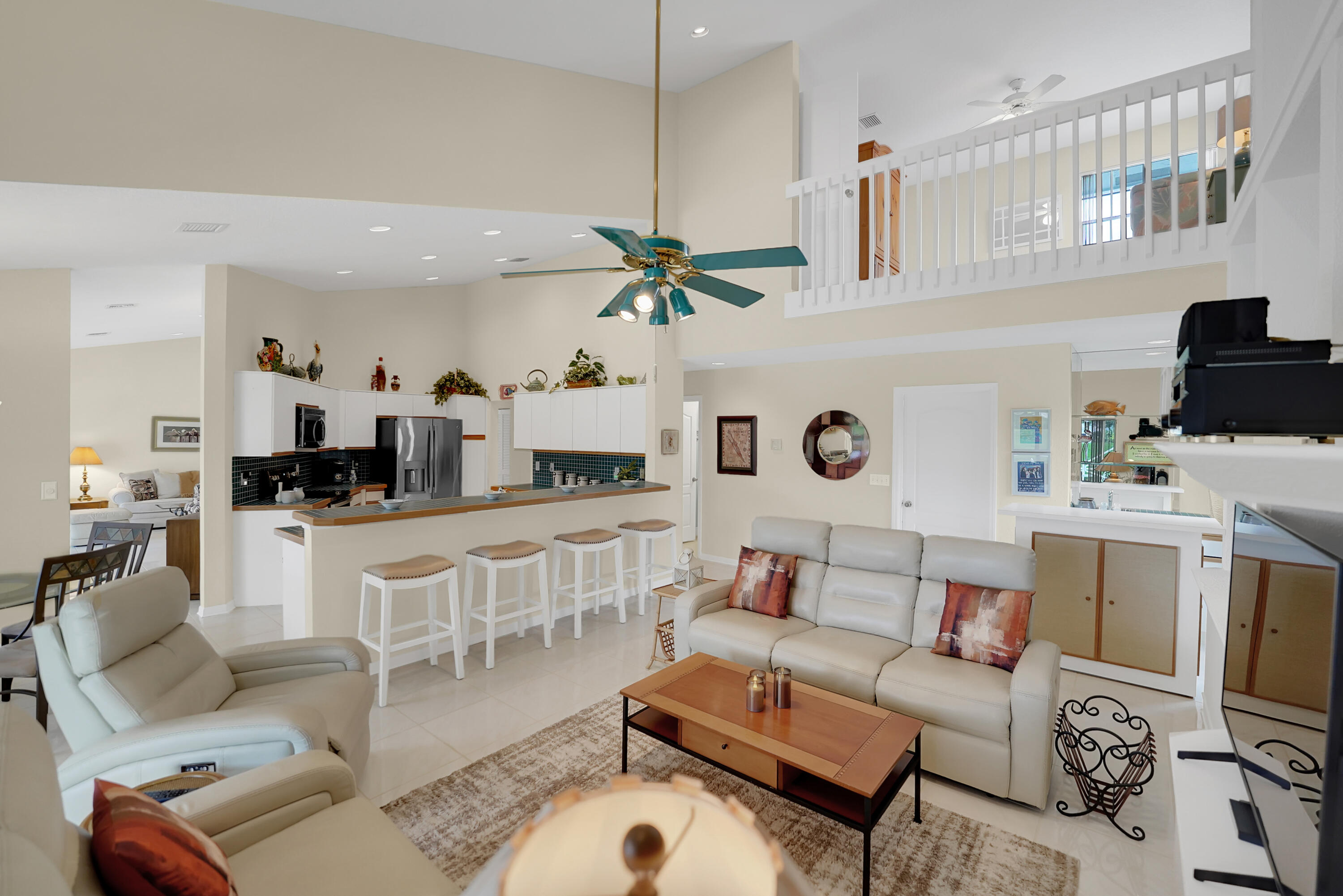 22331 Kettle Creek Way Boca Raton, FL 33428 - Photo 32 of 86 a living room with furniture a rug and white walls