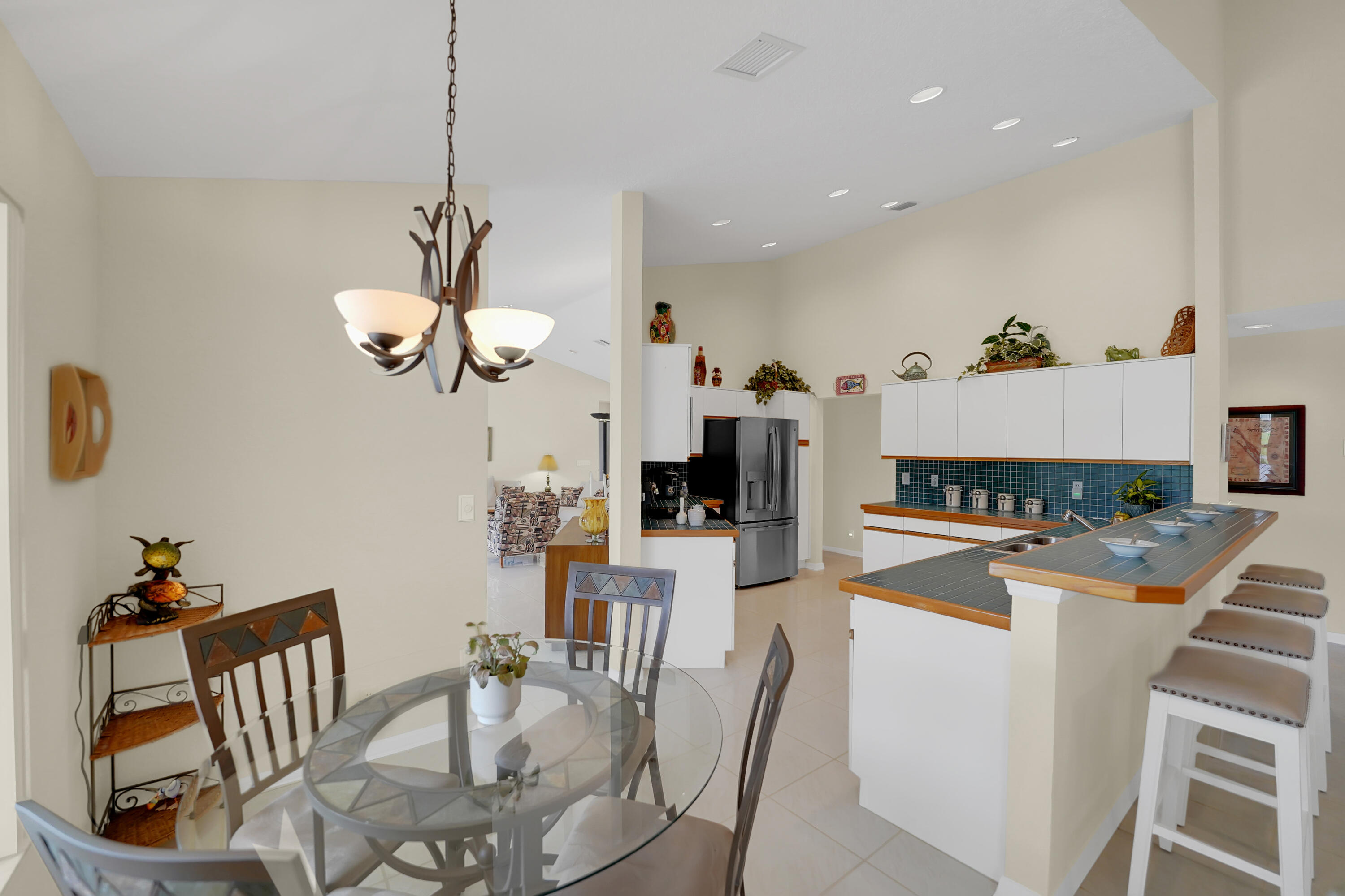 22331 Kettle Creek Way Boca Raton, FL 33428 - Photo 33 of 86 a view of a dining room with furniture and a chandelier