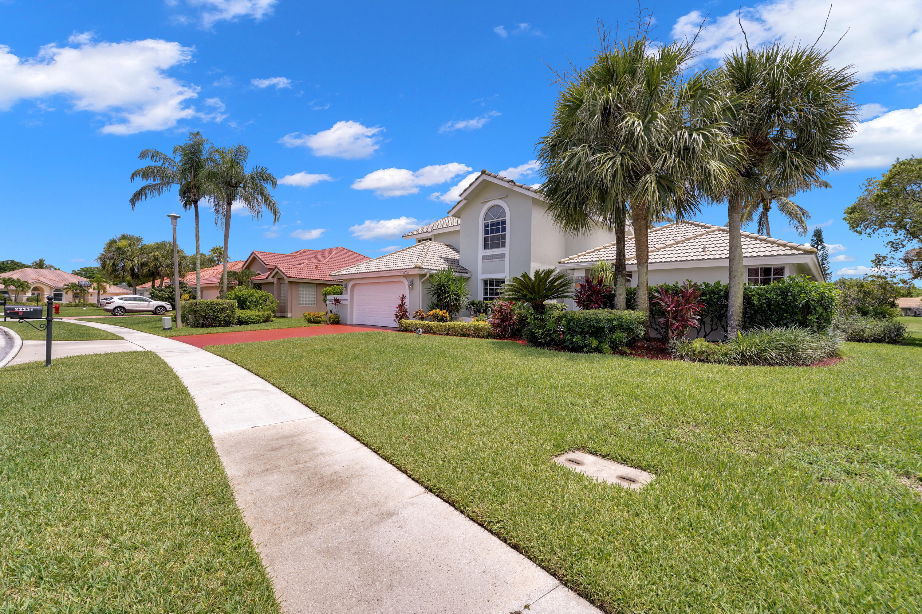 22331 Kettle Creek Way Boca Raton, FL 33428 - Photo 4 of 86 a front view of house with yard and green space