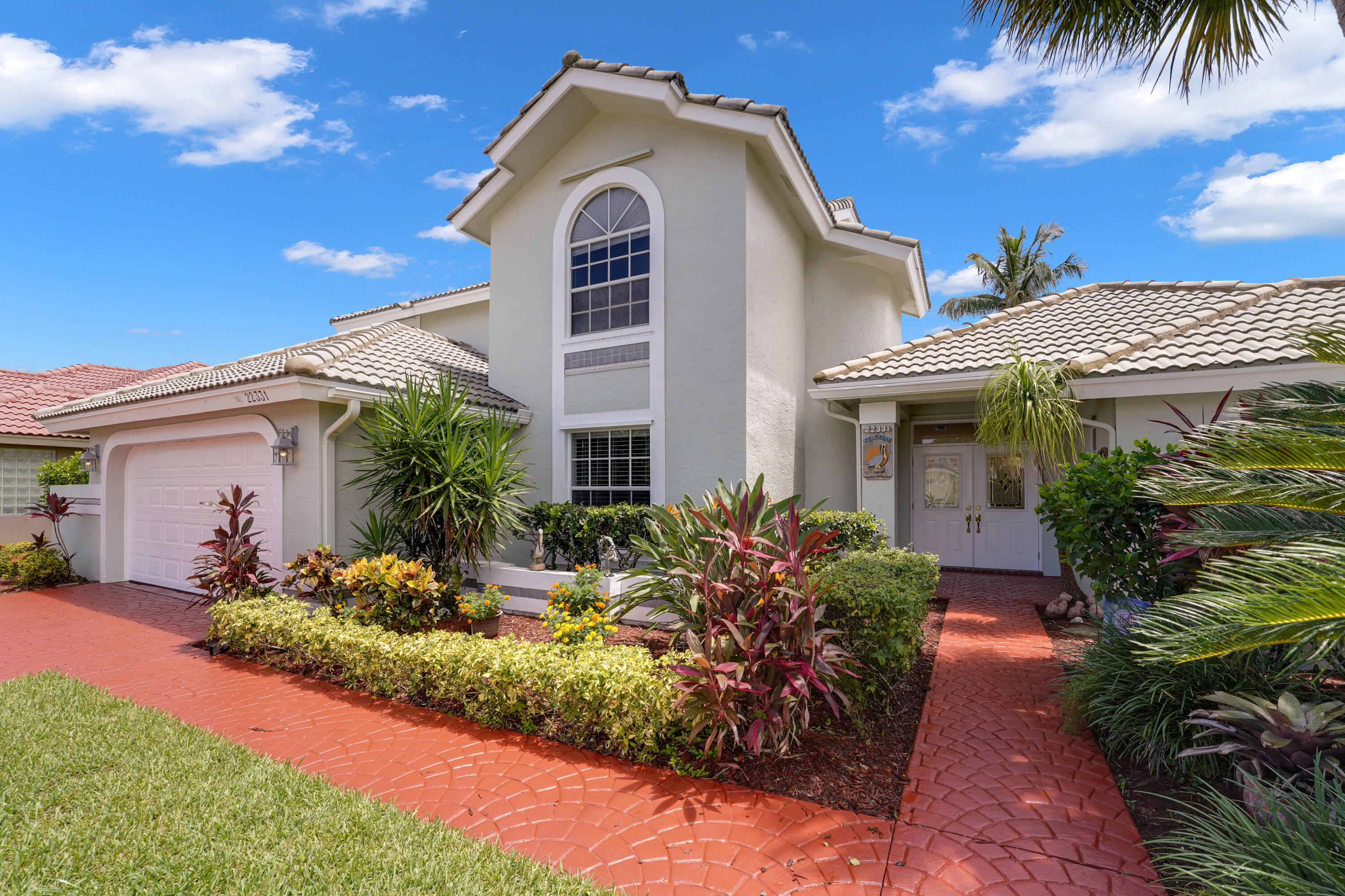 22331 Kettle Creek Way Boca Raton, FL 33428 - Photo 5 of 86 a front view of a house with a yard