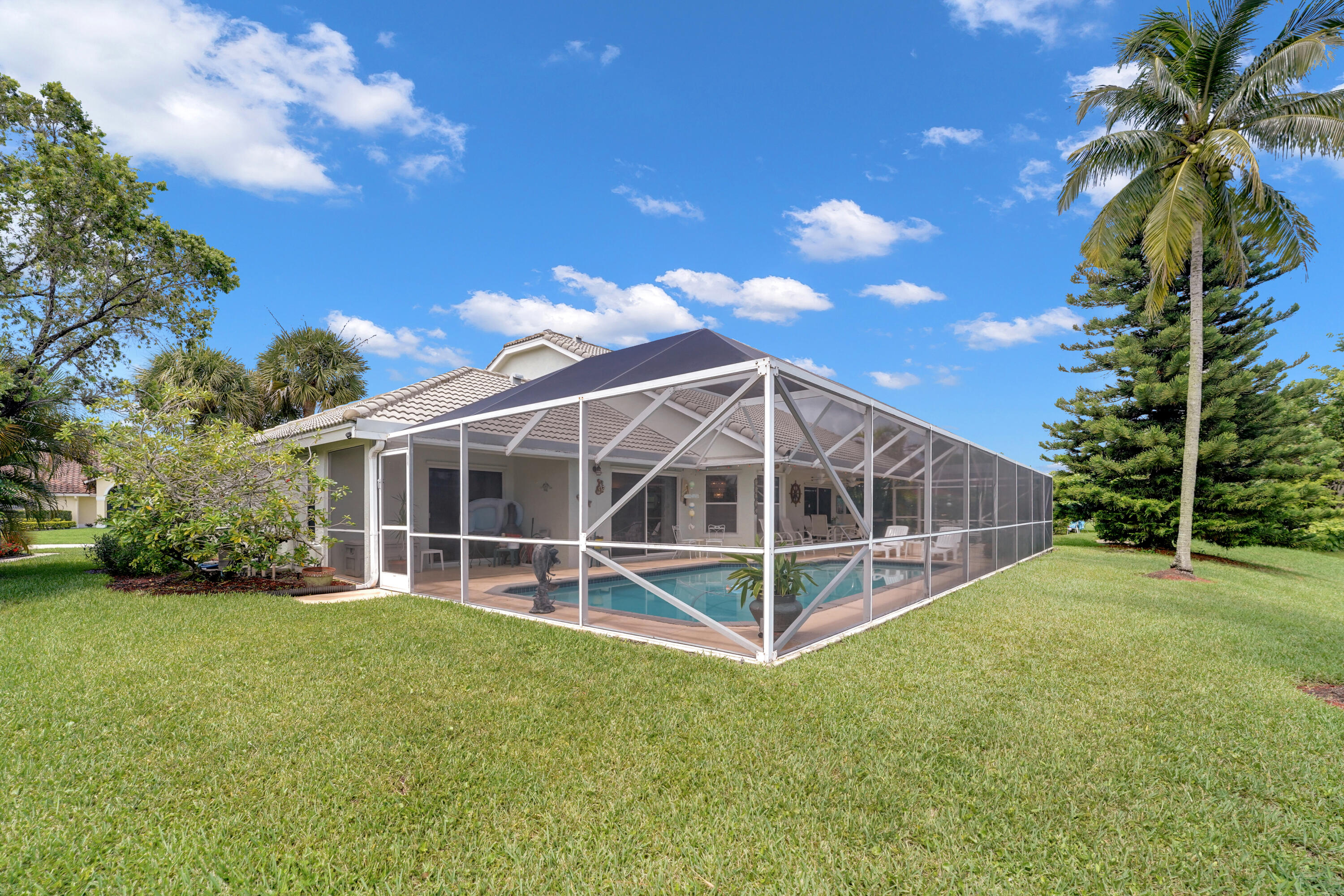 22331 Kettle Creek Way Boca Raton, FL 33428 - Photo 67 of 86 a view of a backyard with a garden and entertaining space