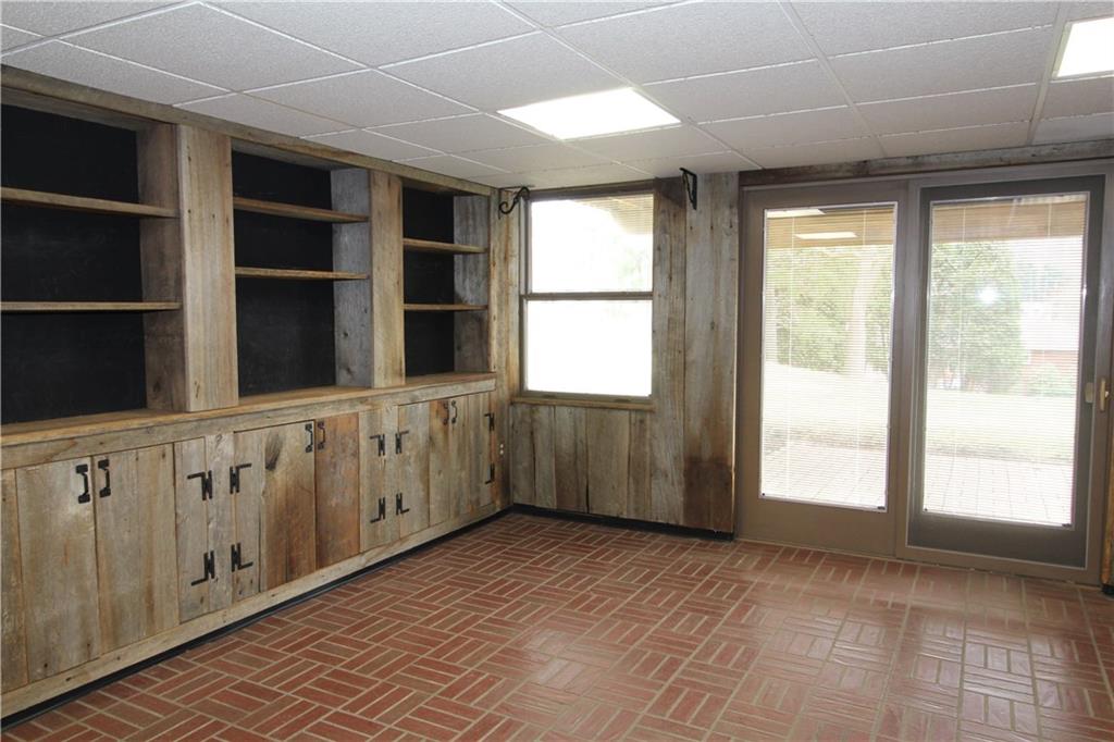 197 Seegar Road Pittsburgh, PA 15241 - Photo 21 of 25 The lower level daylight game room with its open and closed storage bookcases, is perfect for a home office or play area.