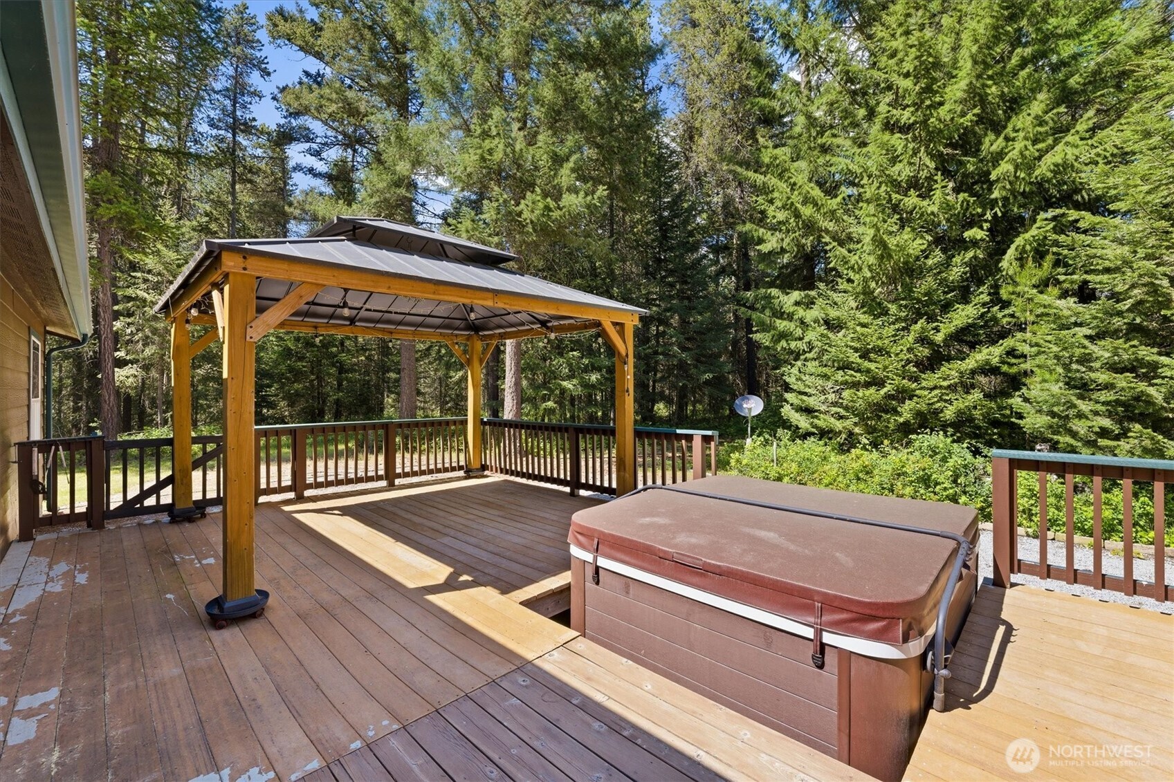 1142 Driskill Road Newport, WA 99156 - Photo 26 of 40 a view of a roof deck with wooden floor and fence