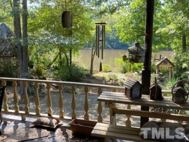 1164 Keith Hills Road Lillington, NC 27546 - Photo 13 of 47 a view of a balcony with lake view and wooden floor