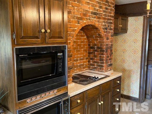 1164 Keith Hills Road Lillington, NC 27546 - Photo 26 of 47 a stove top oven sitting inside of a kitchen