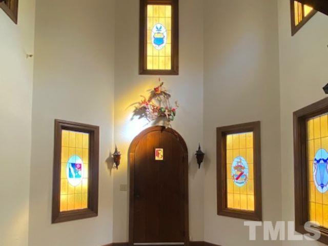 1164 Keith Hills Road Lillington, NC 27546 - Photo 33 of 47 a front view of a house with large windows