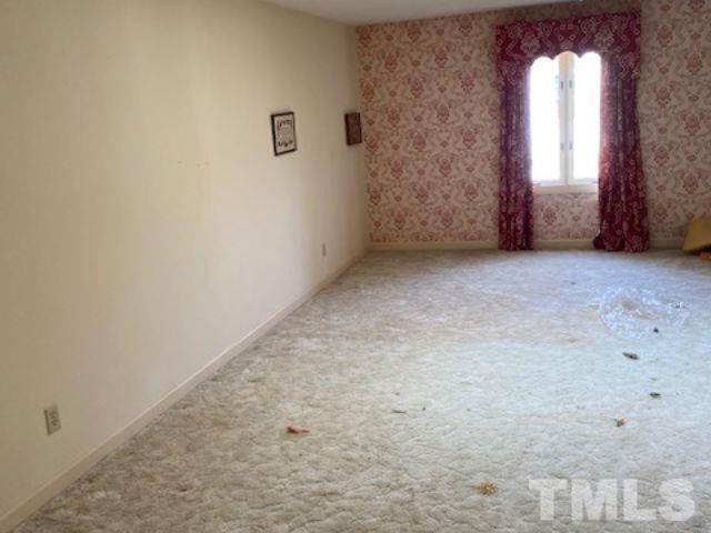 1164 Keith Hills Road Lillington, NC 27546 - Photo 46 of 47 an empty room with windows