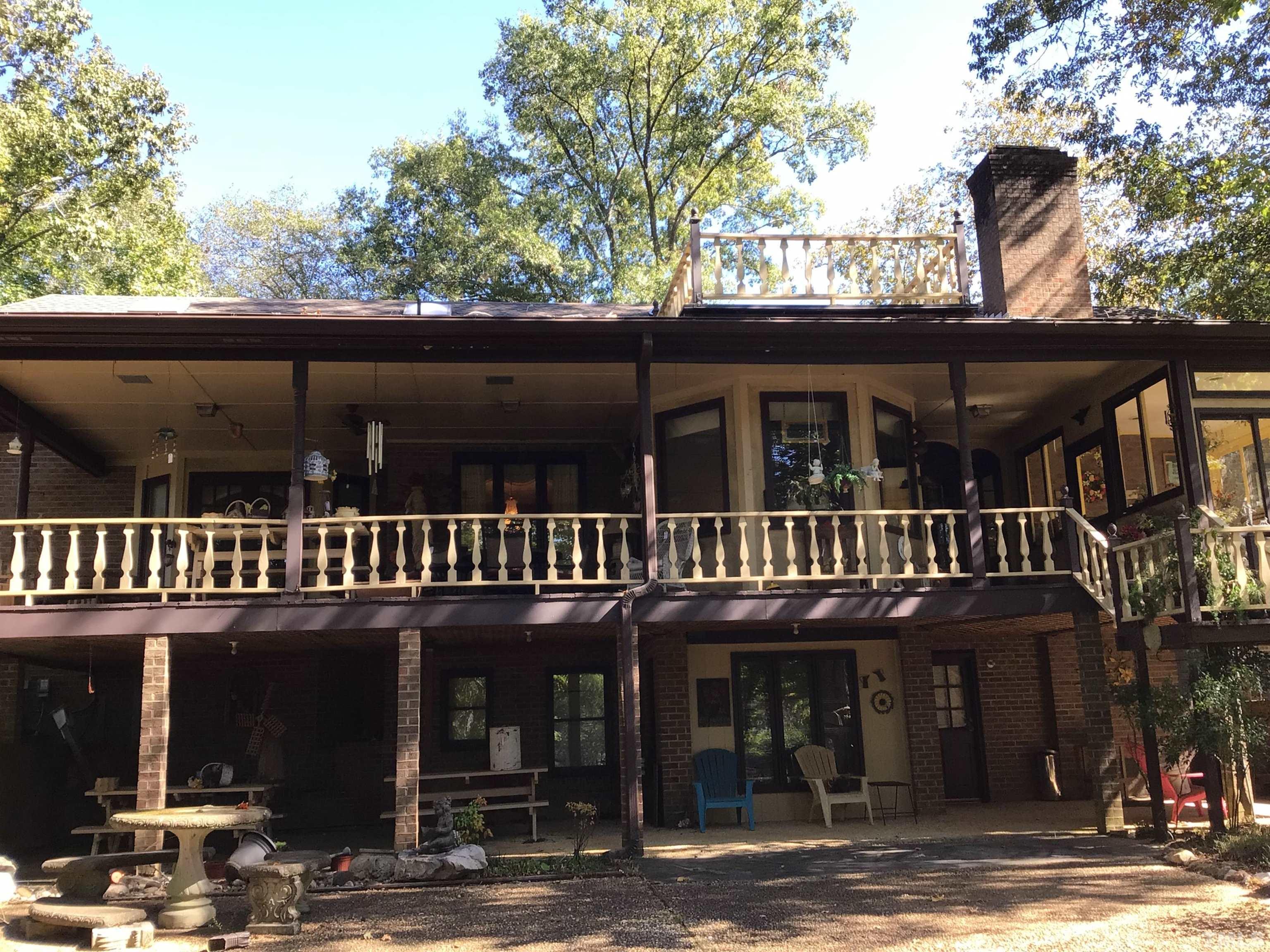 1164 Keith Hills Road Lillington, NC 27546 - Photo 9 of 47 a view of a house with a balcony