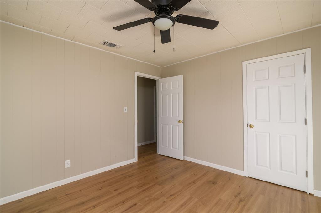 1456 Cooper Street Saline, LA 71070 - Photo 18 of 24 a view of an empty room with window and wooden floor