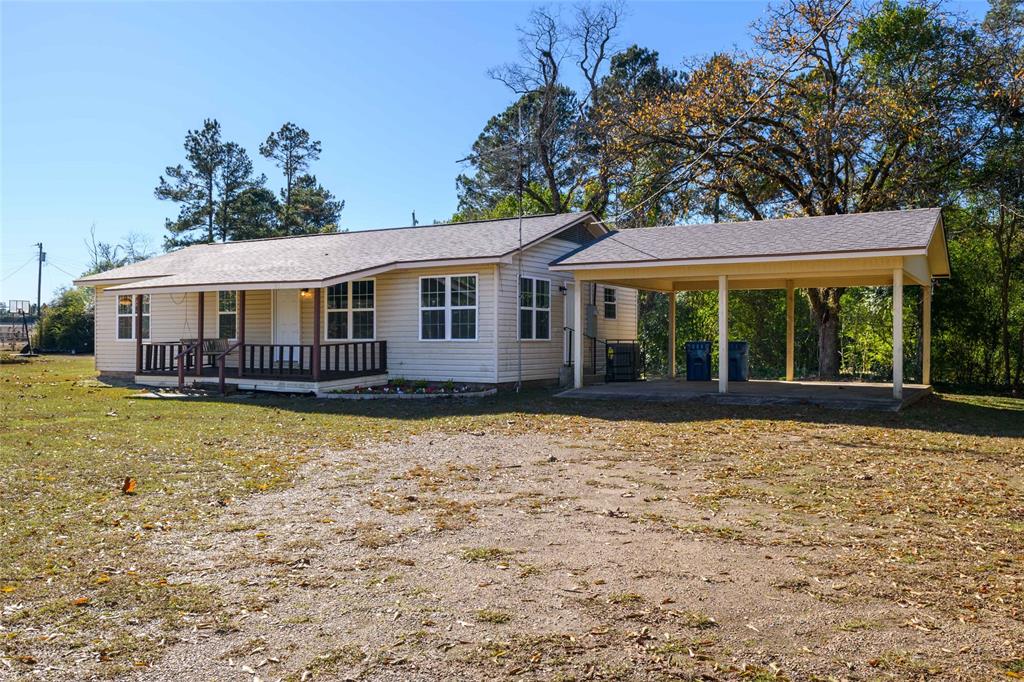1456 Cooper Street Saline, LA 71070 - Photo 2 of 24 a house with swimming pool in front of it
