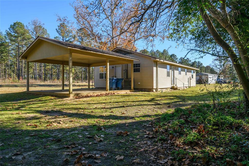 1456 Cooper Street Saline, LA 71070 - Photo 23 of 24 a view of a house with a big yard