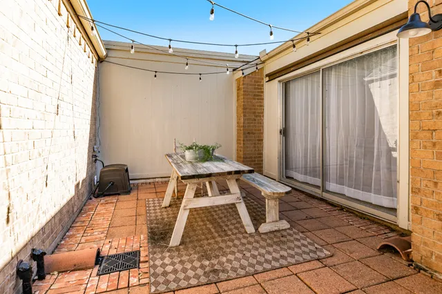 a table and chair in front of a door