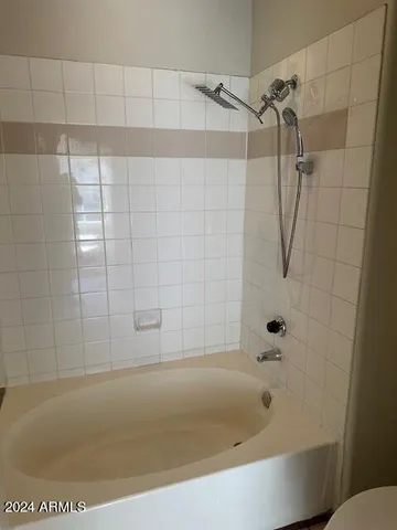 a bathroom with a bath tub